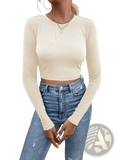 Cream-colored ribbed long sleeve crop top with back satin bow detail shown from the back side