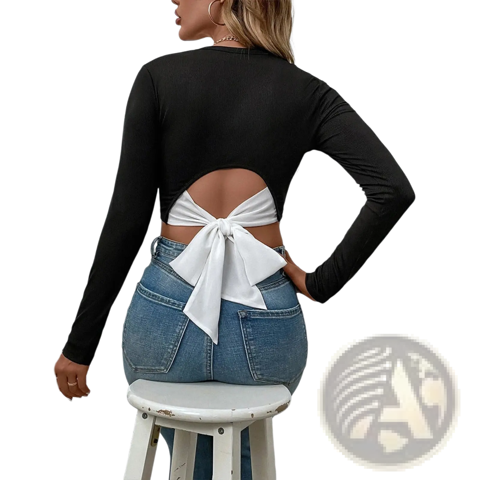 Back view of a black ribbed long sleeve crop top with a white satin bow tied at the back