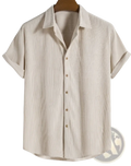Beige short sleeve mens button up shirt with vertical ribbed texture in lightweight breathable fabric