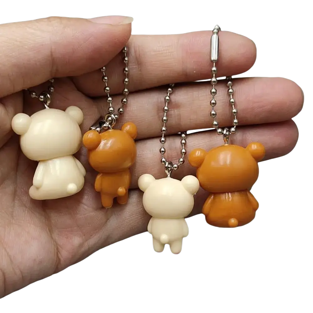 Rilakkuma bear keychain cute diy pendant with beige and orange smooth plastic bodies and silver ball chains
