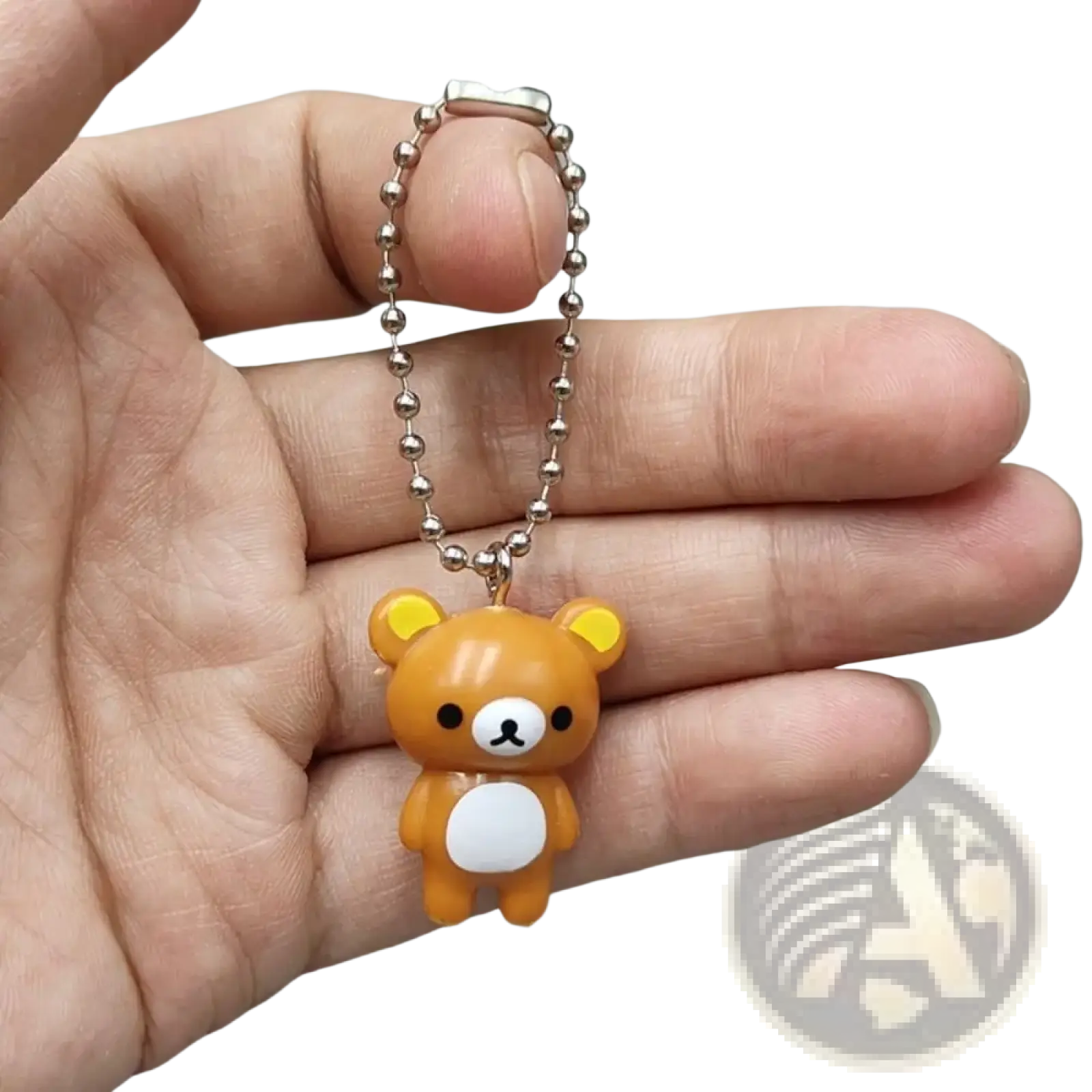 A small orange rilakkuma bear keychain charm with white belly and silver ball chain for cute diy pendant use