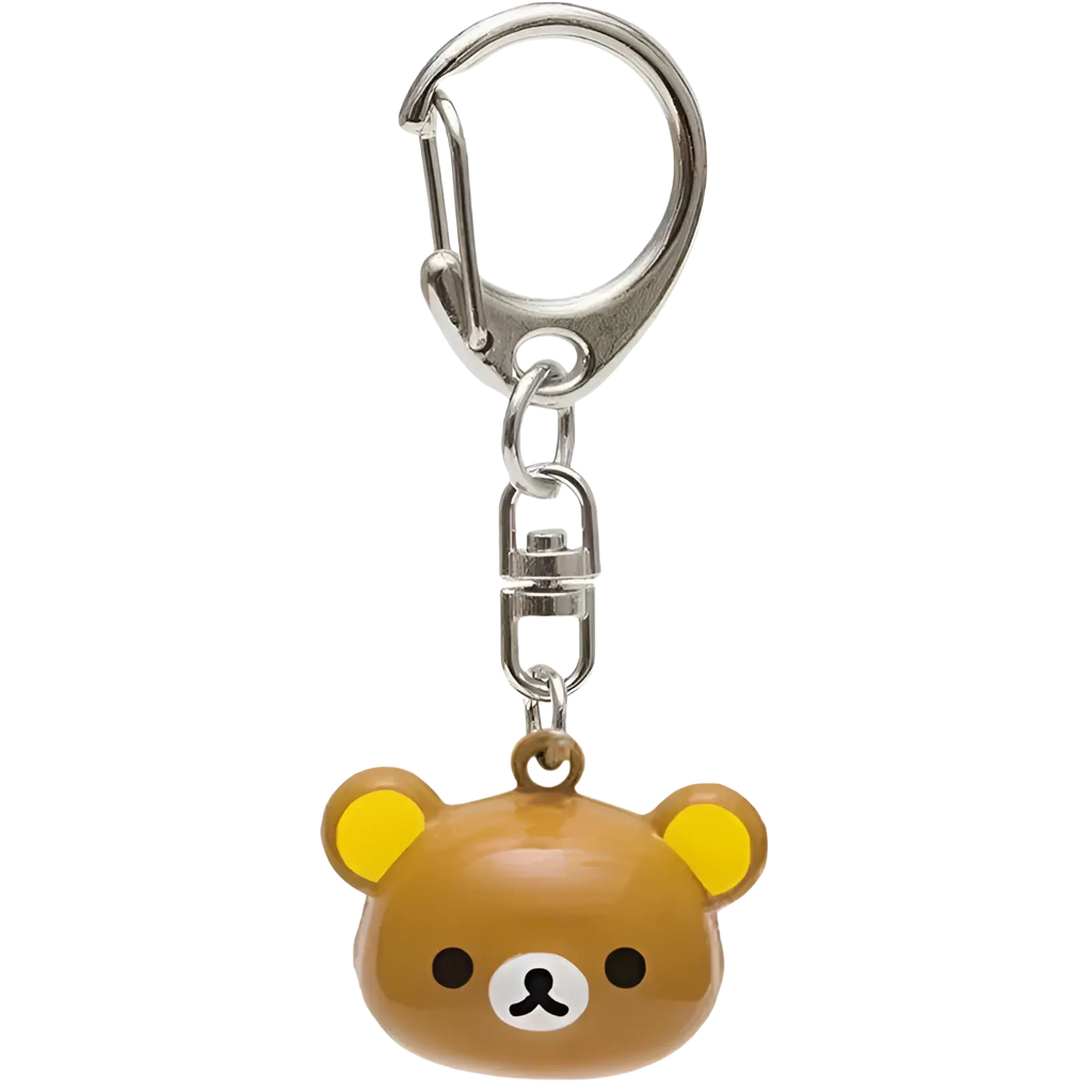 A brown rilakkuma bear keychain with yellow ears and white muzzle featuring glossy plastic enamel charm detailing