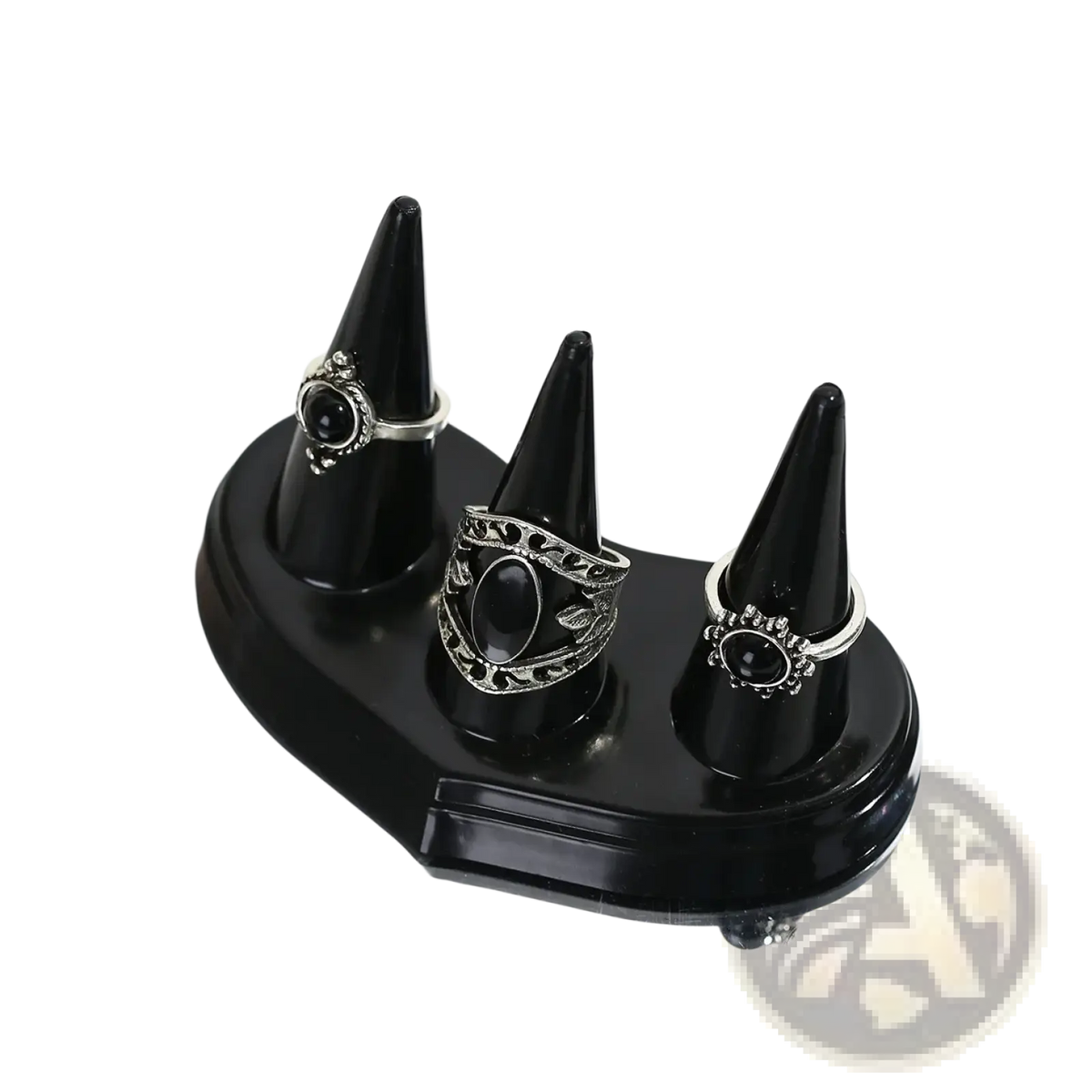 Black plastic glossy ring holder with three conical stands displaying silver ornate rings with black oval gemstones