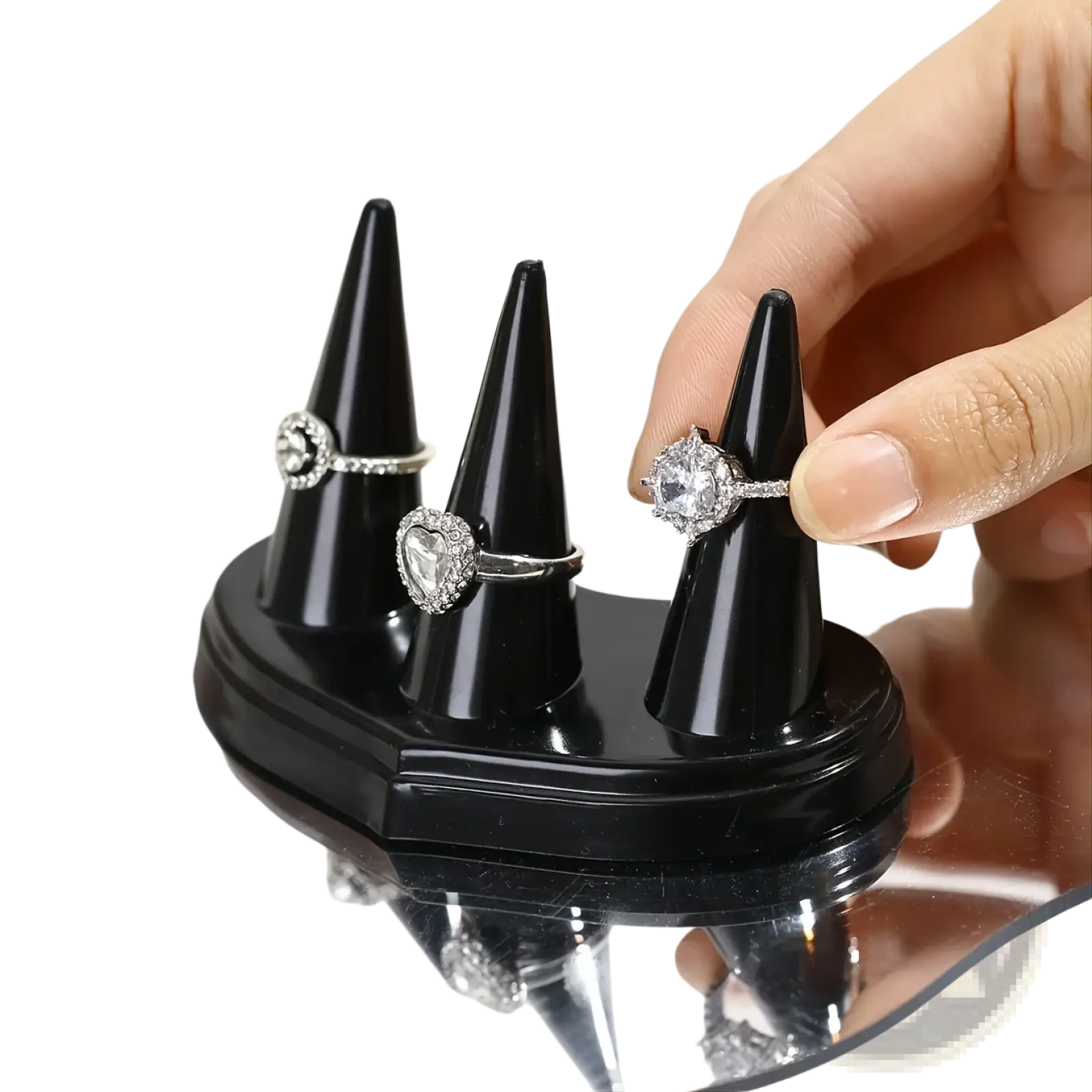 Black glossy plastic ring holder display stand with three conical holders for showcasing rings elegantly