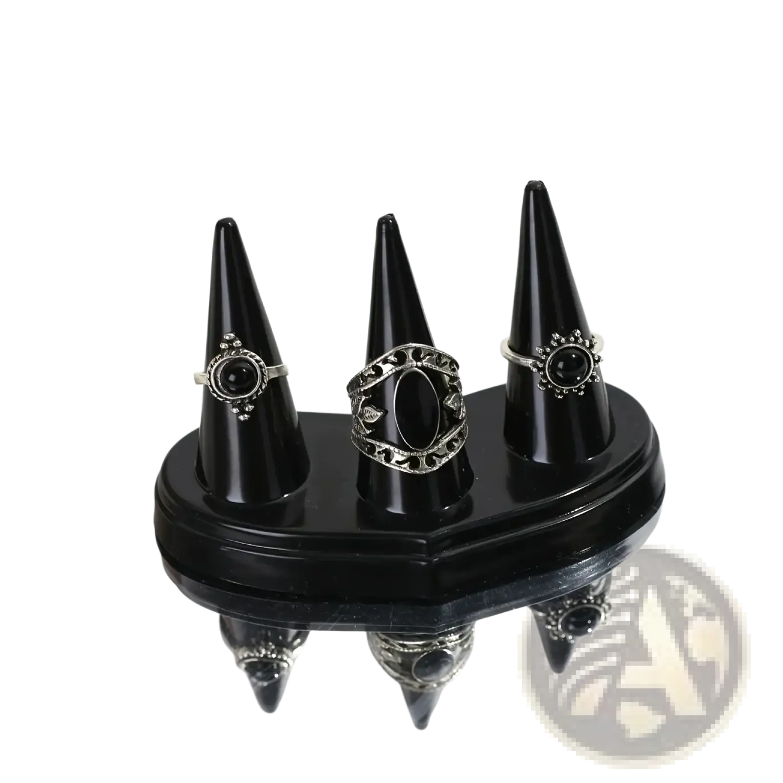 Black plastic conical ring holder display stand with three silver-toned rings featuring black onyx and filigree designs