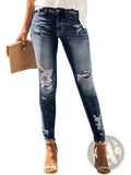 Ripped high stretch skinny jeans for women in dark-wash denim with distressed ripped details at knees and thighs