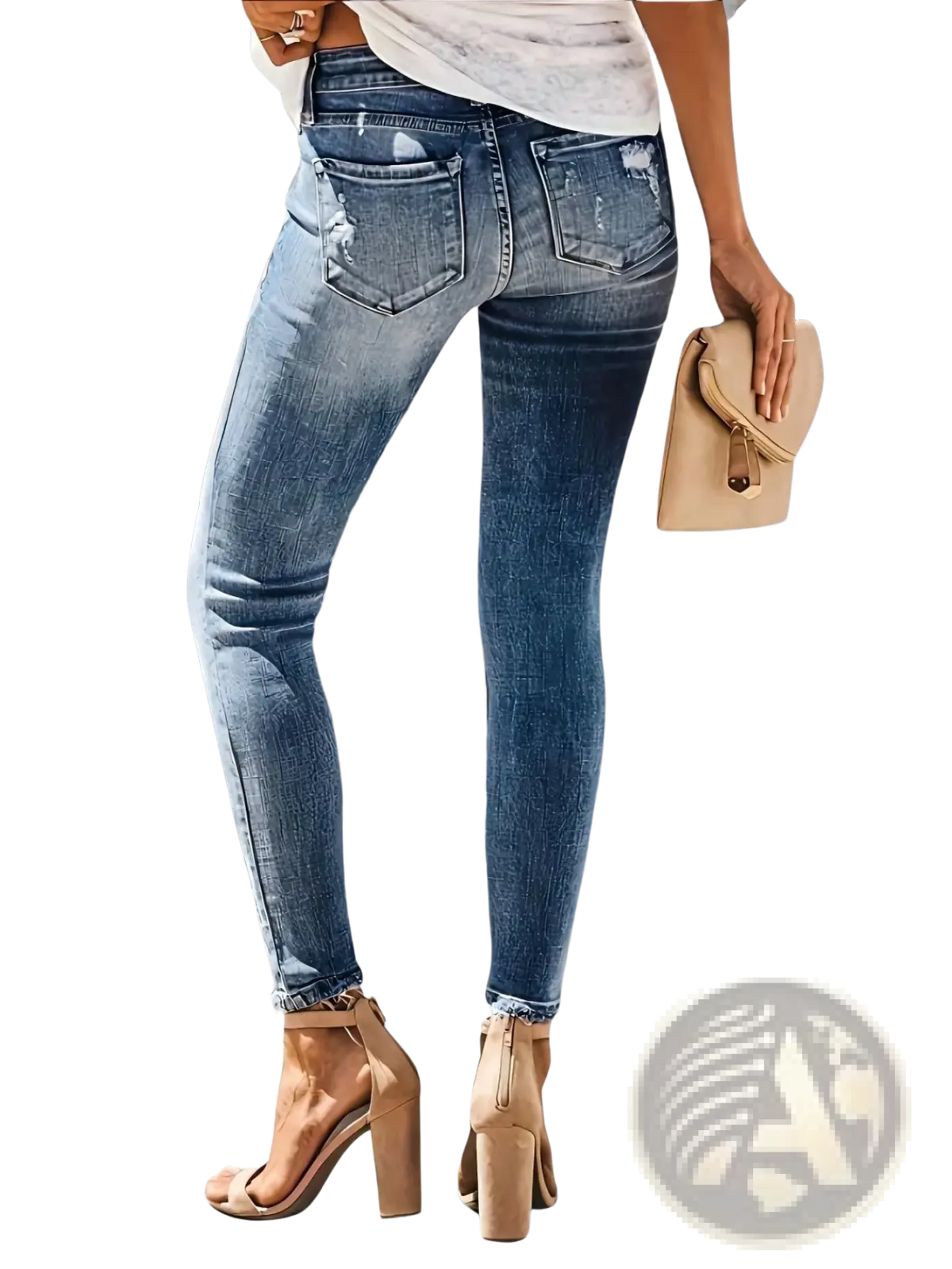 High-waisted ripped high stretch skinny jeans for women in faded blue denim with distressed back pockets shown from the back