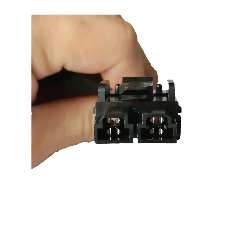 Black plastic rkn4152a power cord automotive electrical connector with two mating sections and visible metal contacts