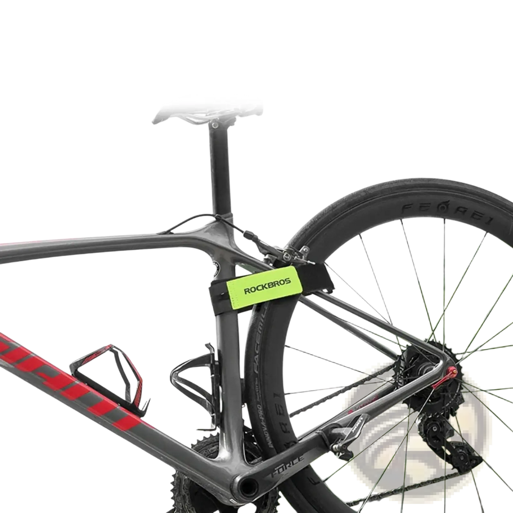 Bright green rectangular rockbros label on black anti-slip bicycle luggage strap attached to luggage rack belt