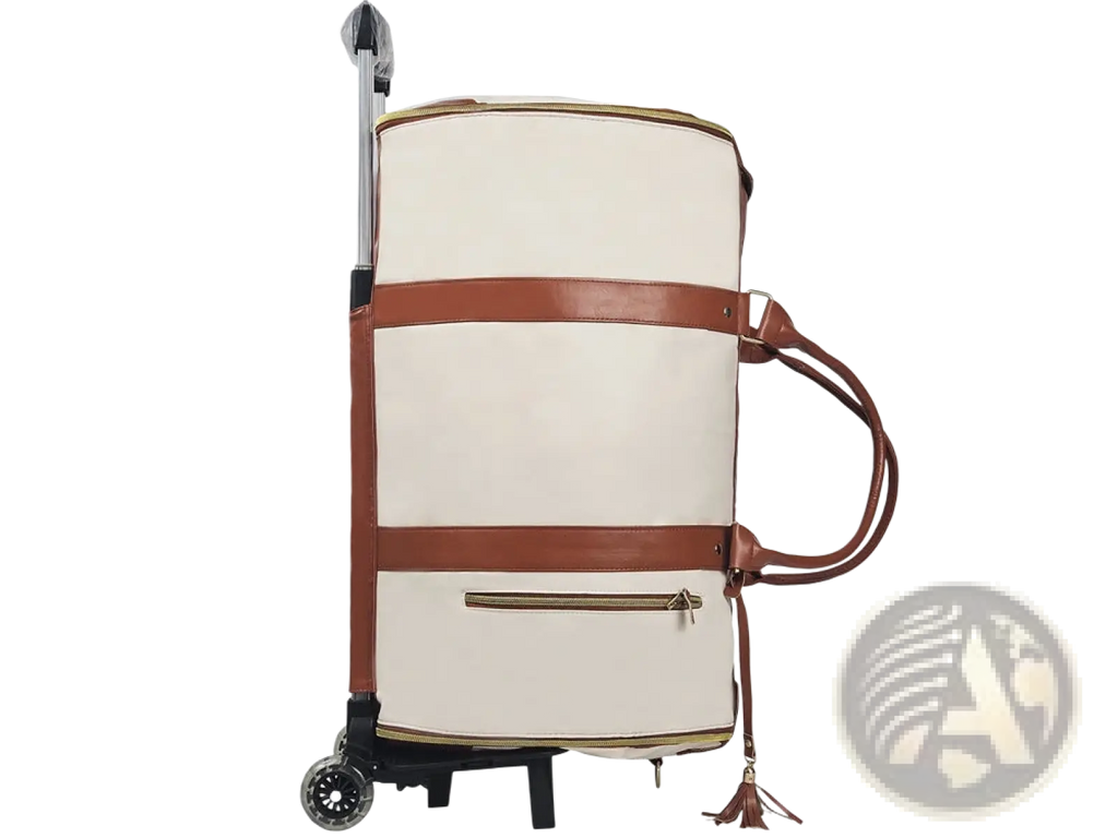 Cream-colored rolling travel bag with brown leather straps and tassel accents for large capacity fitness duffel use