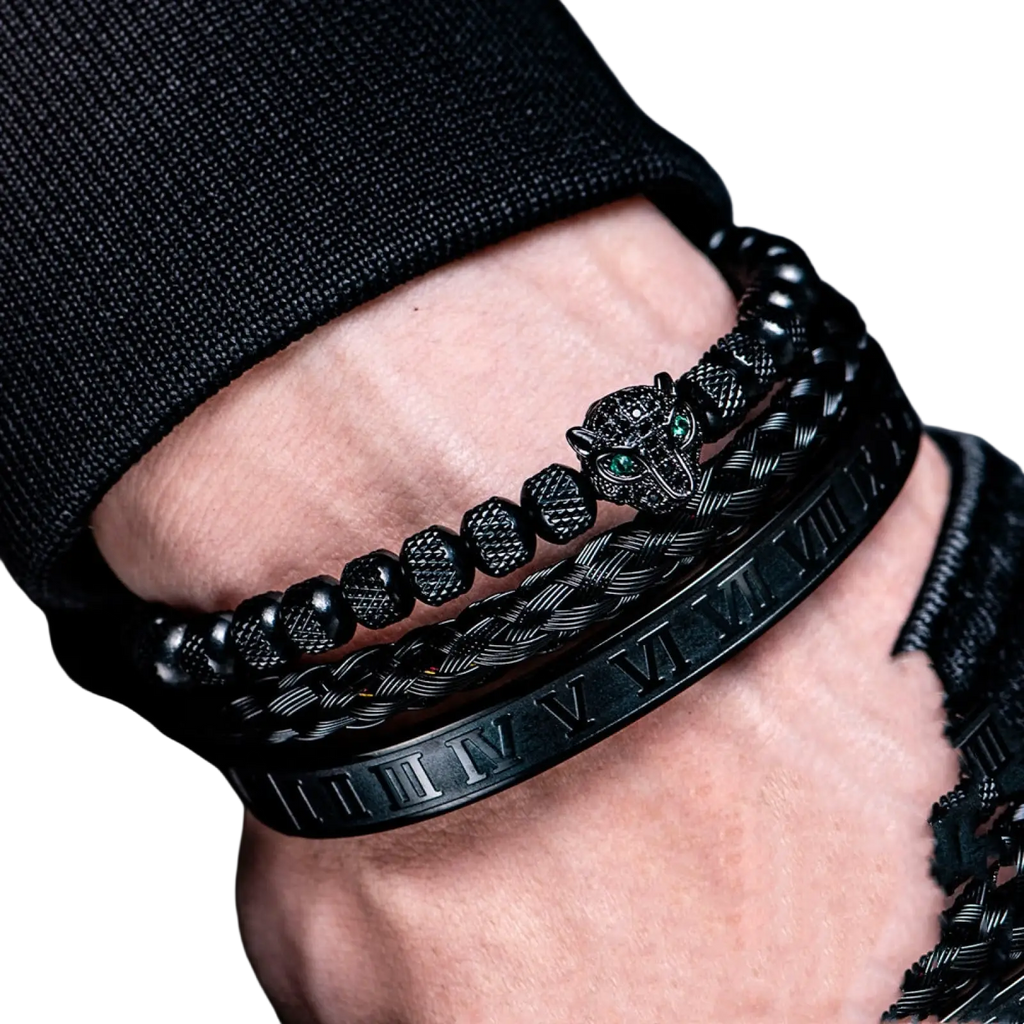 Black braided leather bracelet with textured panther head charm featuring green eyes and roman numeral engraving