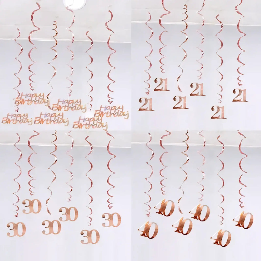 Rose gold metallic spiral birthday swirl decorations with happy birthday and age numbers 21 30 and 40 printed in matching rose gold