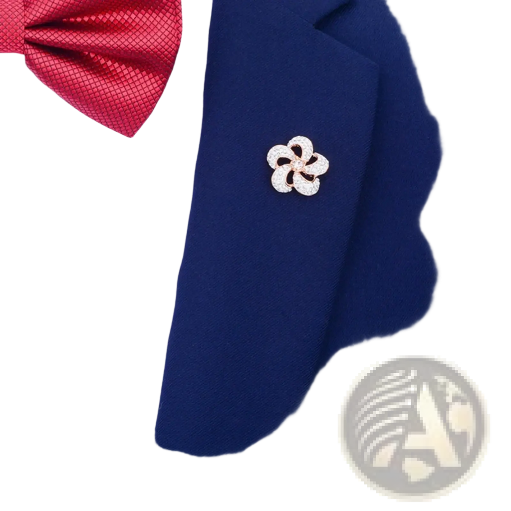 A sparkling rose gold crystal lapel pin flower brooch pinned to a navy blue suit lapel