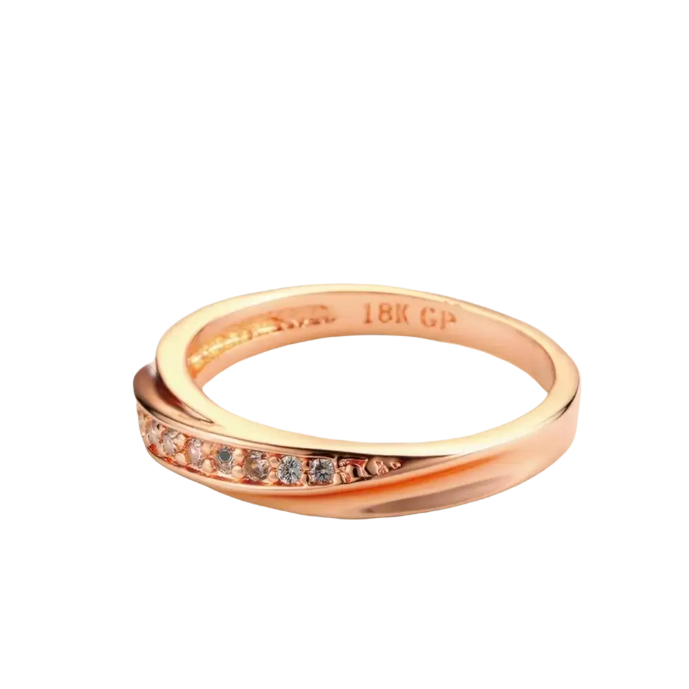 Rose gold cubic zirconia dainty wedding ring with twisted 18k gp band and clear stones along the edge