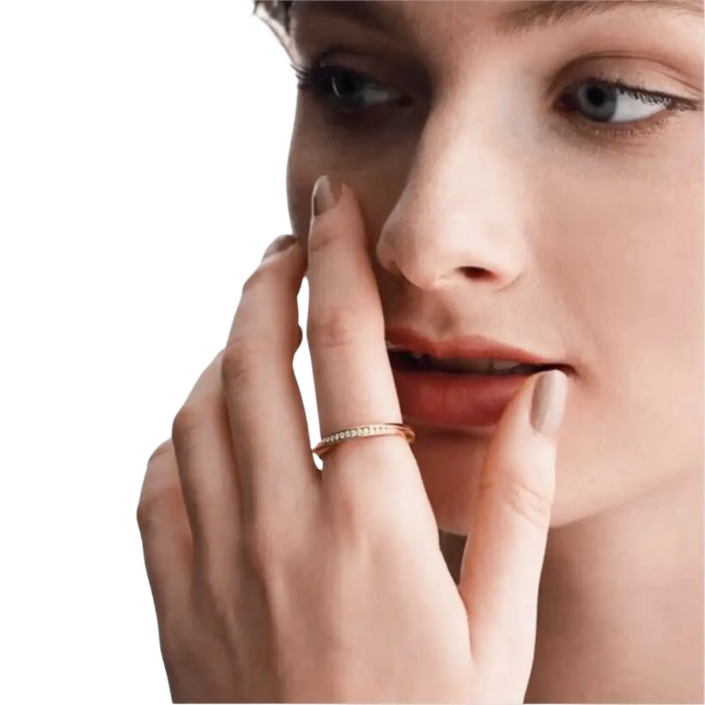 A delicate rose gold dainty wedding ring with a band adorned by small sparkling cubic zirconia stones