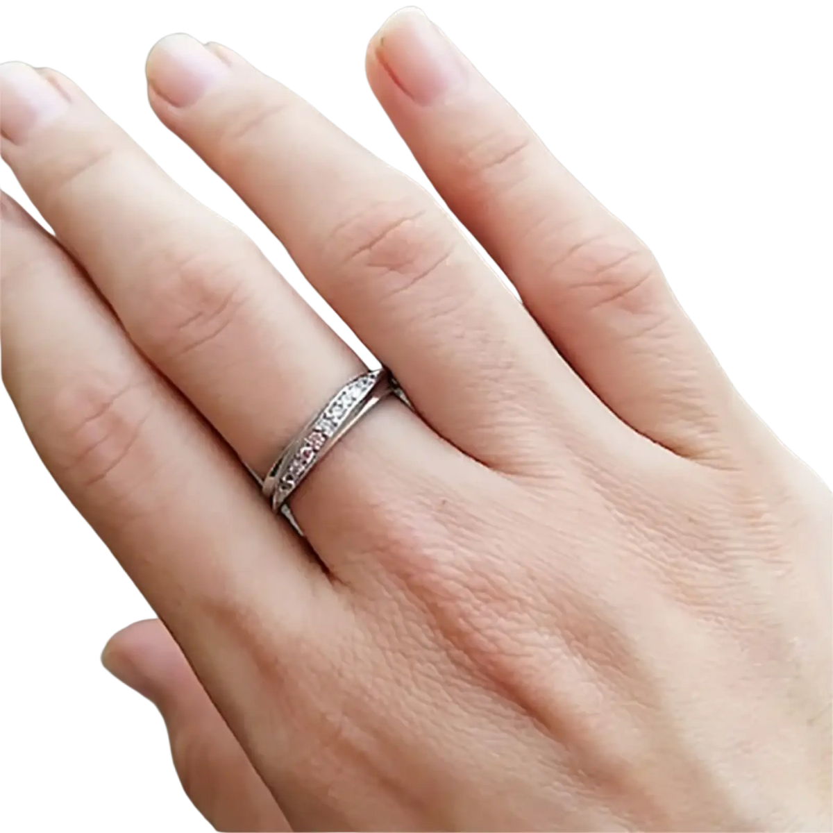 Rose gold dainty wedding ring with a delicate silver band and small sparkling cubic zirconia stones