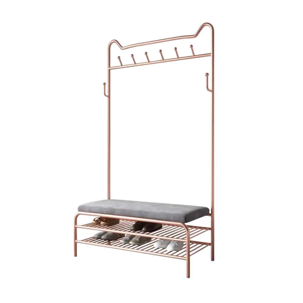 Rose gold kids clothes rack with a gray upholstered bench seat and two lower metal shelves for shoe storage