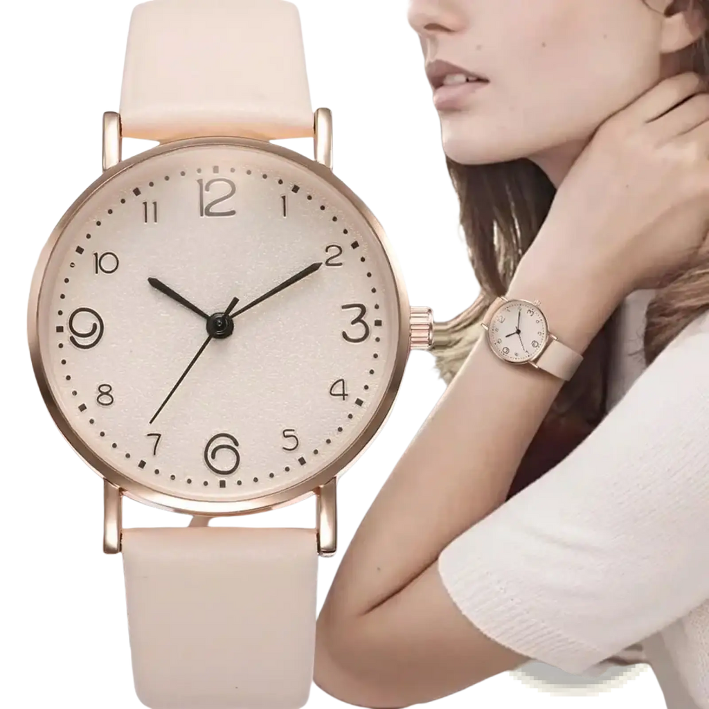 A delicate rose gold leather casual watch with cream leather strap and minimalist black Arabic numerals on round face