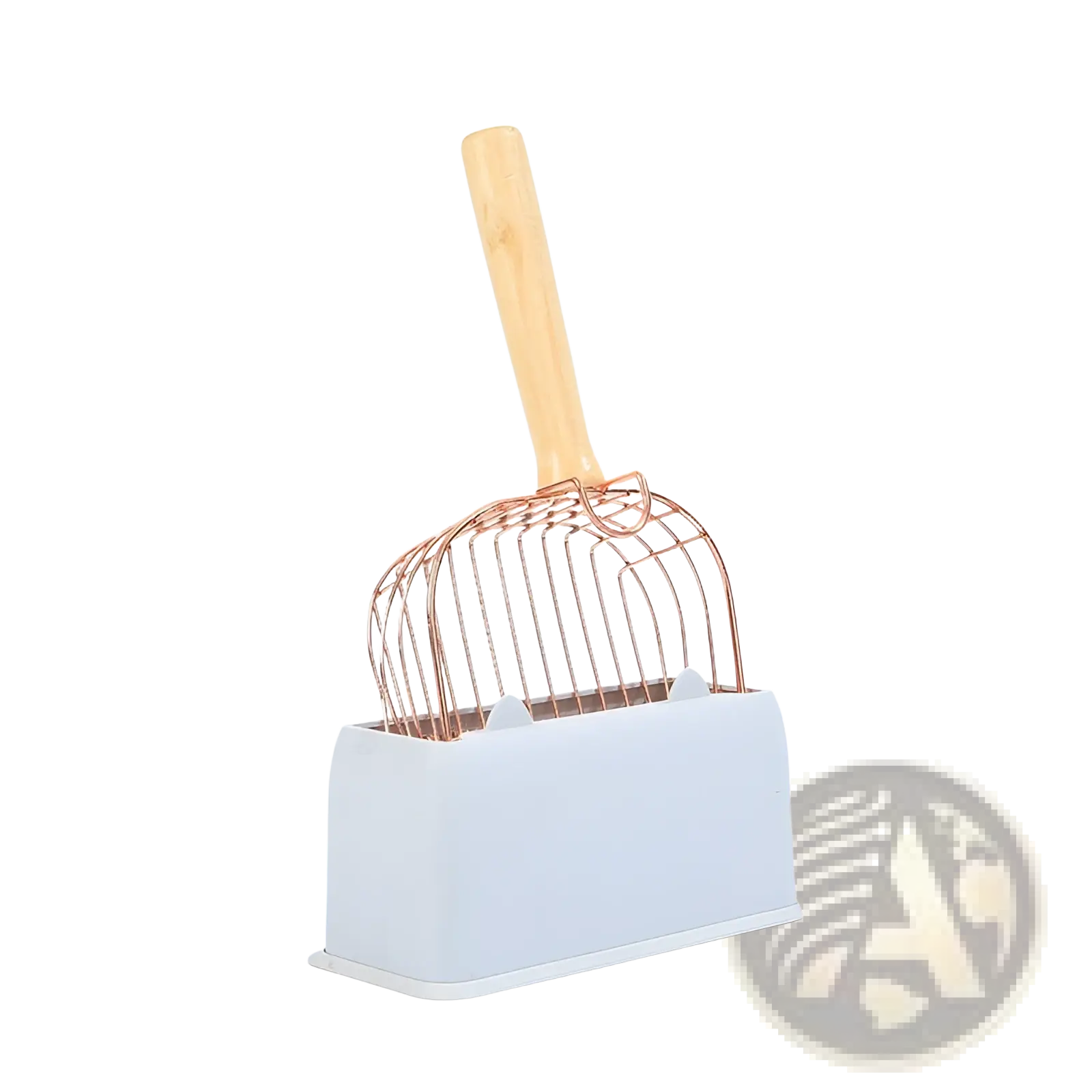 Rose gold metal cat litter scoop with a light wood handle resting in a white plastic base for easy cleaning