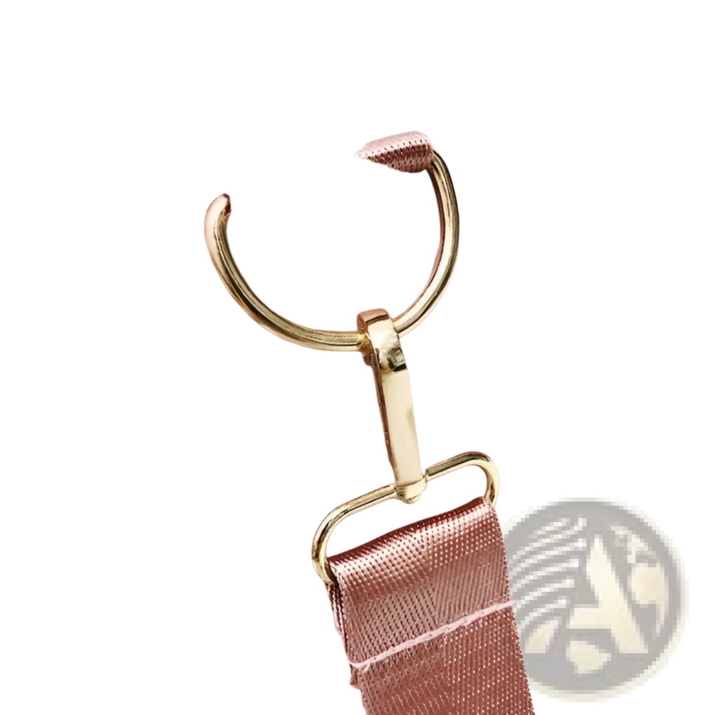 Rose gold nylon waterproof sports duffel bag in pink with gold-tone hardware and matching rose gold strap