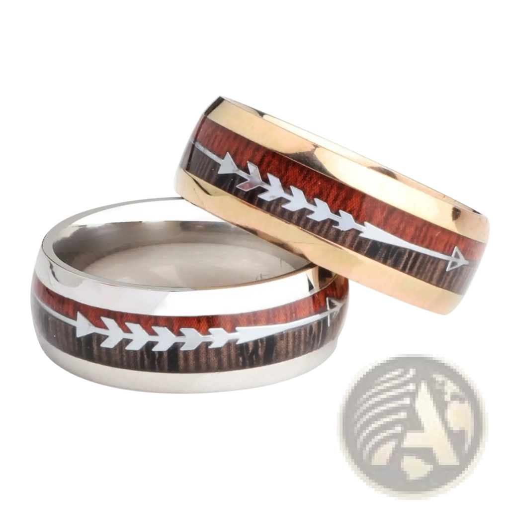 Two wedding bands in rose gold and silver with stainless steel wood grain arrow inlaid design