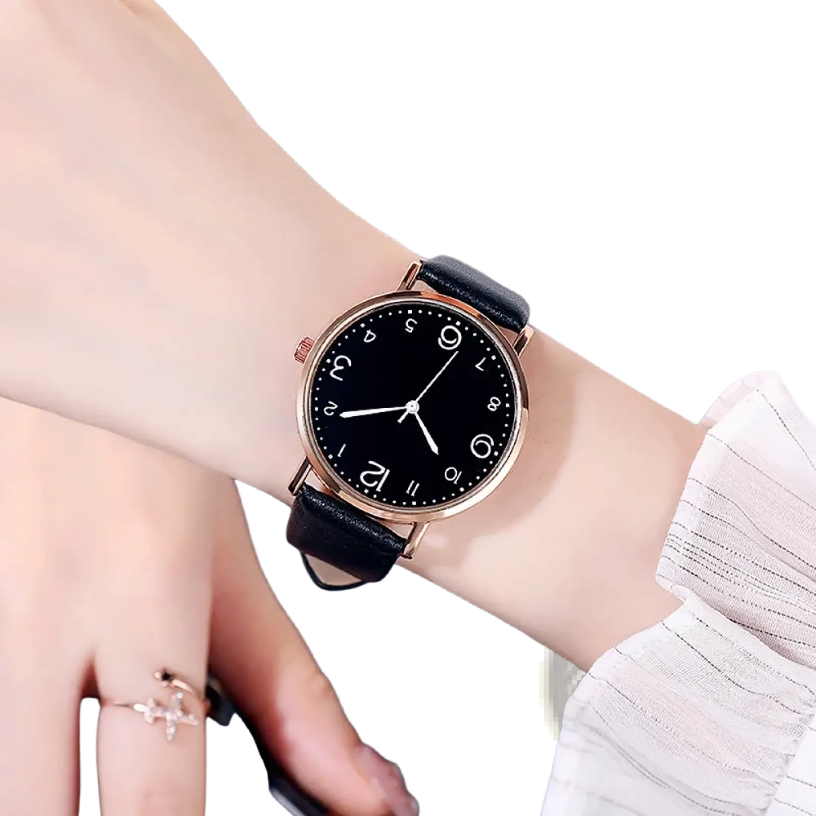 A sleek rose gold women quartz watch with a black dial and leather strap worn on a wrist