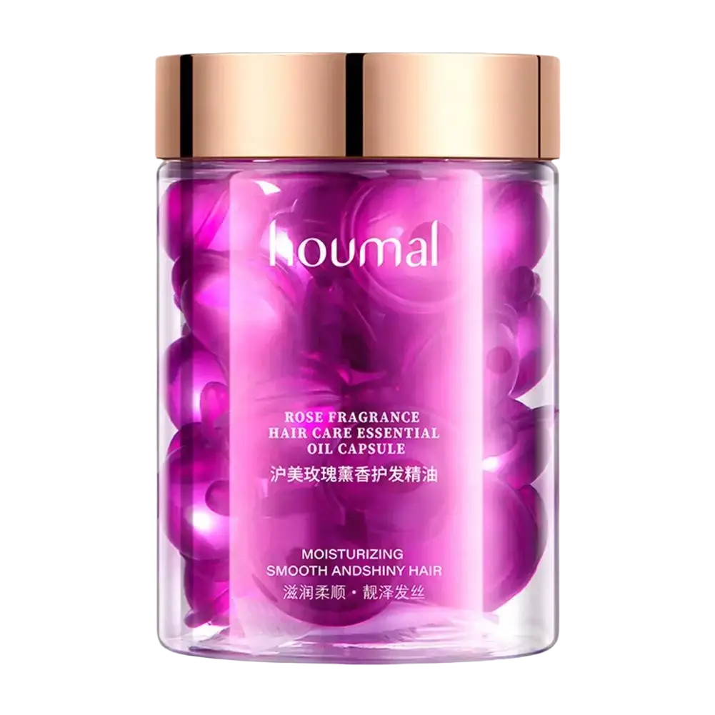 A transparent cylindrical bottle with rose gold lid contains vibrant purple oil capsules for frizzy hair care