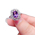 A sparkling silver ring with an oval-cut amethyst, diamonds, and pearl accents from rose quartz sterling silver jewelry set