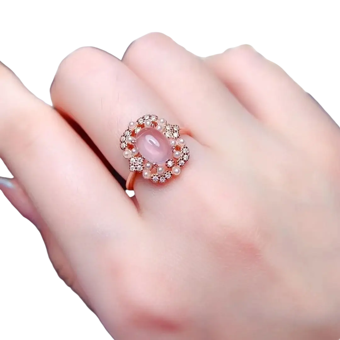 Rose quartz sterling silver jewelry set featuring a rose gold ring with oval pink opal, diamonds, and pearls