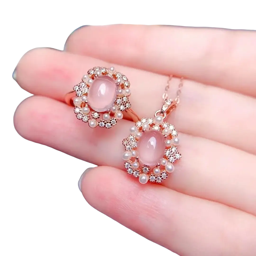 Rose quartz sterling silver jewelry set with rose gold pendant and ring featuring pink moonstone diamonds and pearls