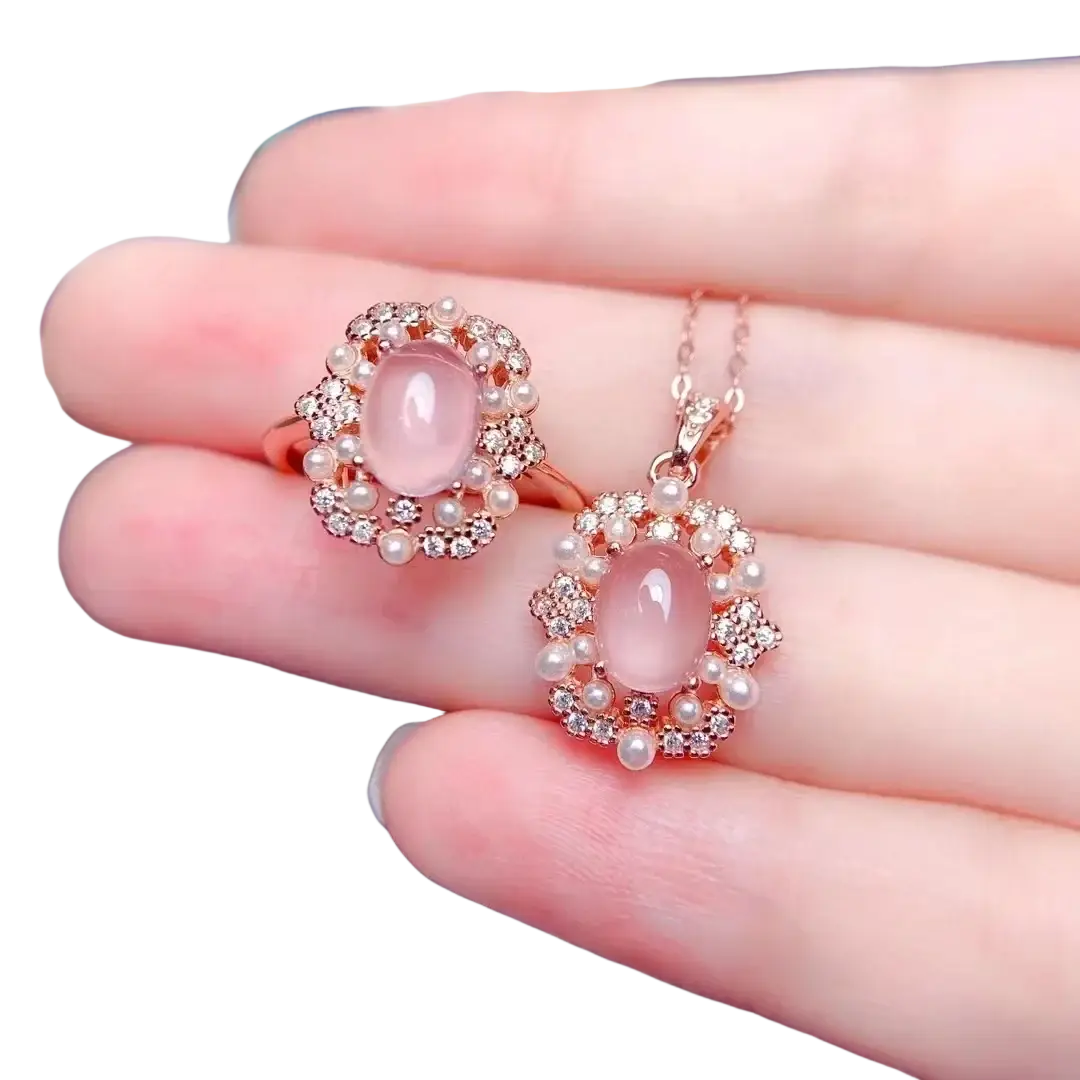 Rose quartz sterling silver jewelry set with rose gold pendant and ring featuring pink opal, clear crystals, and pearls