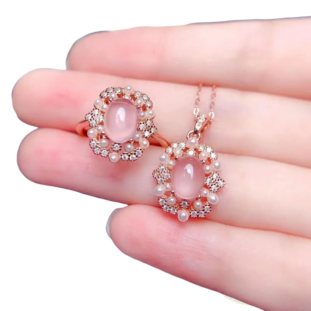 Rose quartz sterling silver jewelry set with rose gold pendant and ring featuring pink opal, clear crystals, and pearls