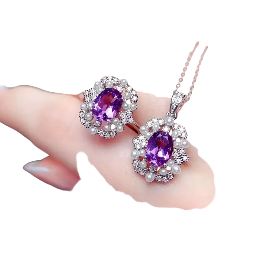 Elegant purple amethyst pendant and matching earrings set with oval-cut stones, diamonds, and pearls in silver-toned metal