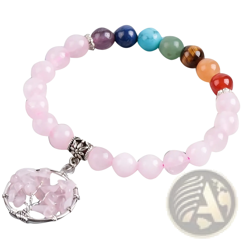 A delicate pink rose quartz beaded bracelet with a silver-toned tree of life charm embedded with crystals