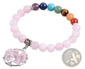 A delicate pink rose quartz beaded bracelet with a silver-toned tree of life charm and colorful chakra gemstones