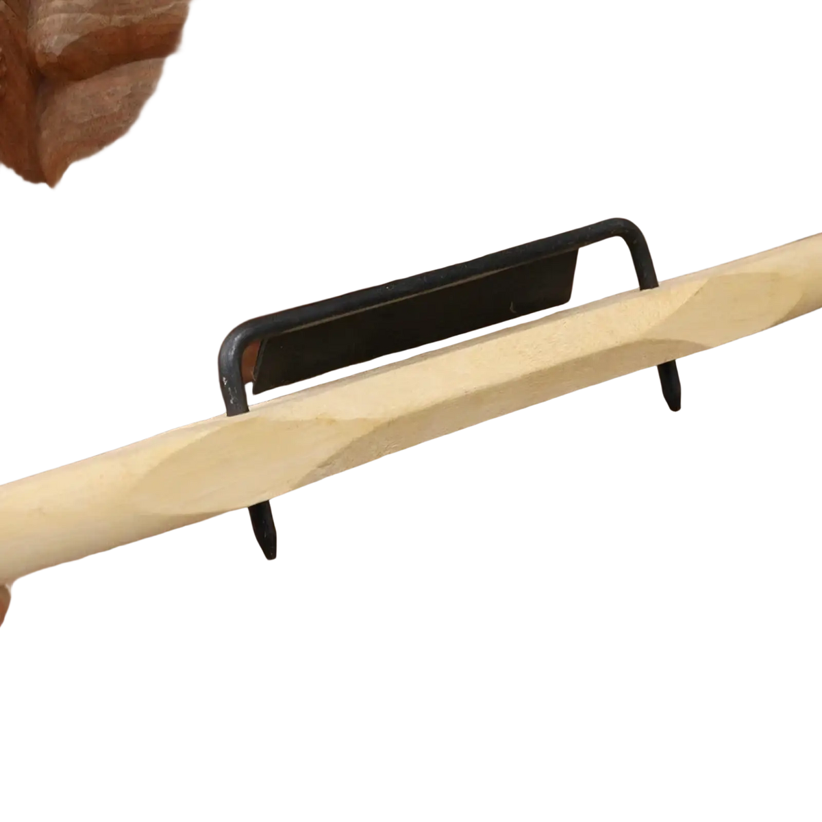 A light-colored rosewood hand planer handle with intricate carvings and a smooth polished finish for woodworking