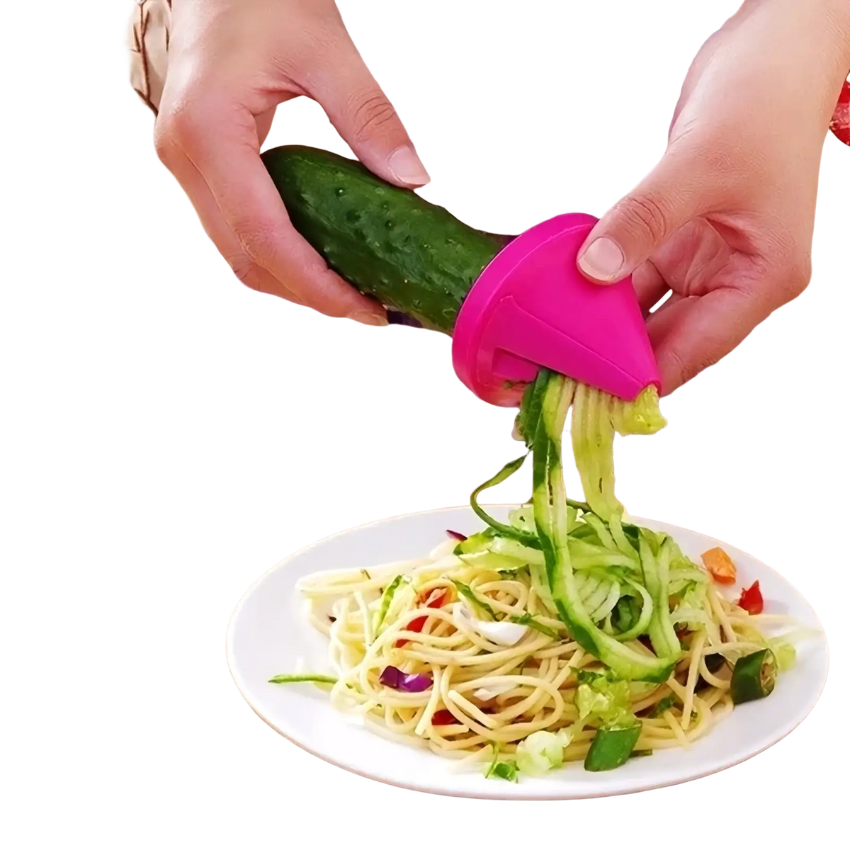Pink plastic rotary vegetable grater and spiral slicer in use creating spiralized vegetables for cooking