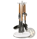 Rotating kitchen utensil holder with white circular base and central rod holding four wooden-handled utensils