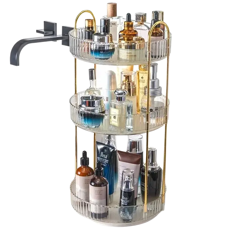 Clear glass three-tiered rotating makeup organizer with gold metal rod frame and large storage capacity