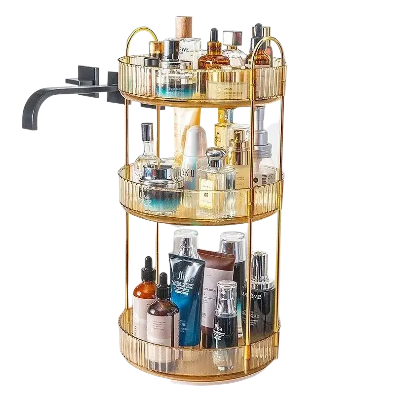 Gold three-tier rotating makeup organizer with large storage clear glass shelves and gold metal rod handles