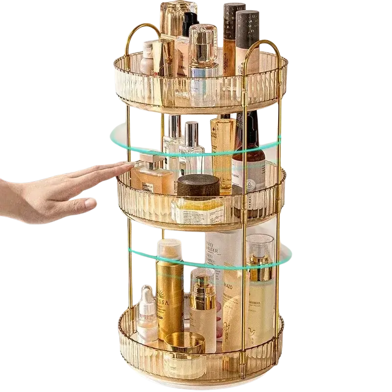 Gold three-tier rotating makeup organizer with large storage, clear glass shelves, ribbed edges, and metal rod design
