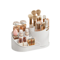 White plastic rotating makeup organizer with vertical ridged texture and multiple compartments for large capacity storage