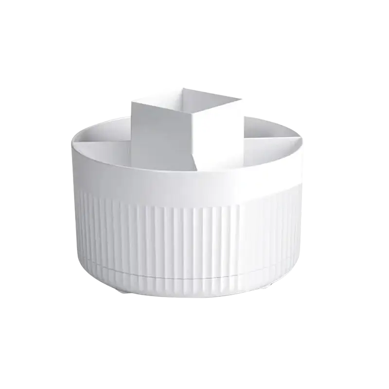 White ribbed plastic rotating makeup organizer with vertical ridges and central square compartment for storage