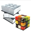 Colorful rubiks cube shaped dessert made with a 9-cavity silicone mousse baking mold featuring multicolored chocolate and gold leaf accents