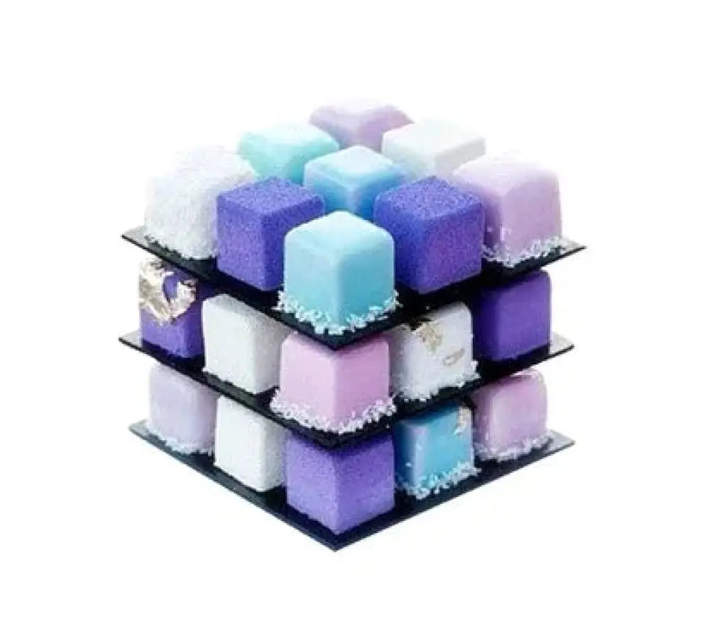 A stack of pastel-colored cube-shaped desserts made with a 9-cavity Rubik’s Cube silicone mousse baking mold