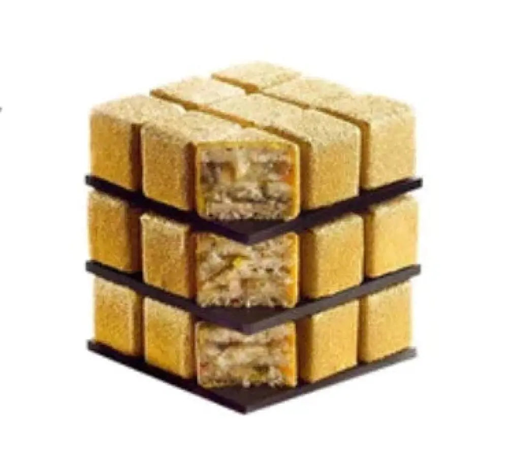 Golden, cube-shaped silicone mousse dessert with textured exterior and layered filling made using 9-cavity rubiks cube mold