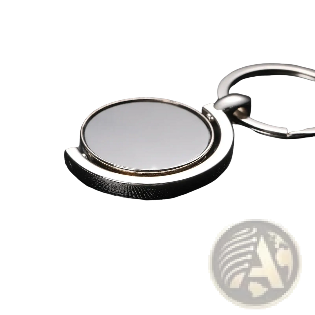 Rotating silver circle keychain featuring a circular reflective face and polished metal rings for gifting