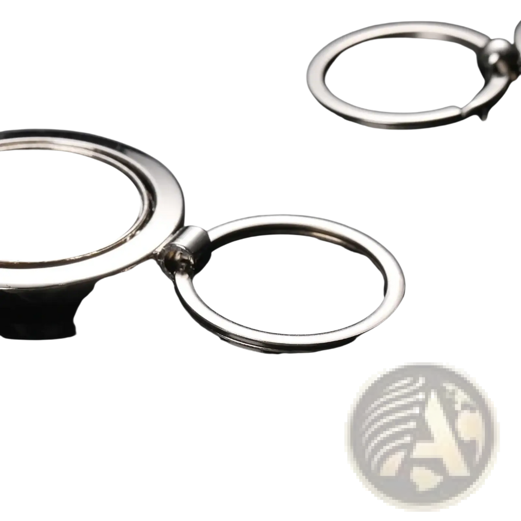 Rotating silver circle keychain featuring a silver metallic flat disc attached to a ring by a hinge mechanism