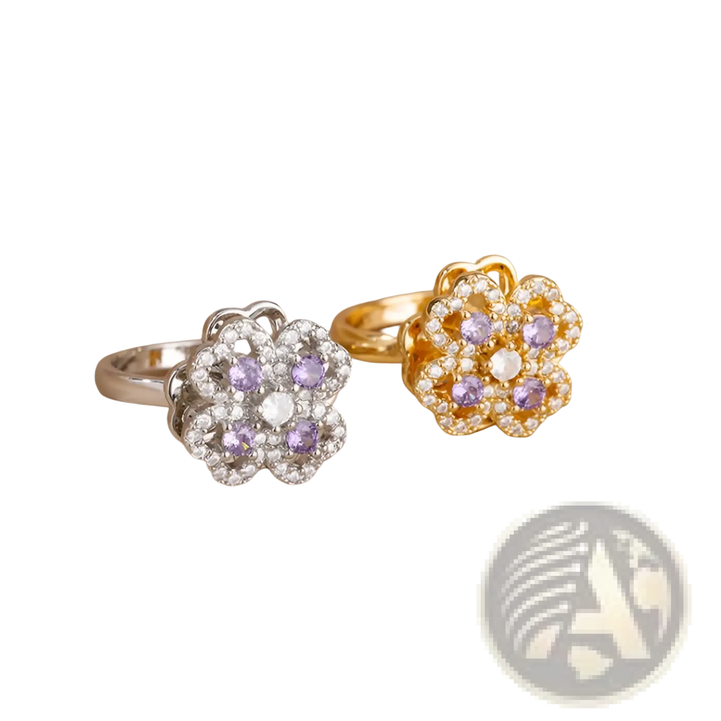 Two floral-designed rotating zircon four leaf clover adjustable rings in silver and gold with purple gemstones and crystals