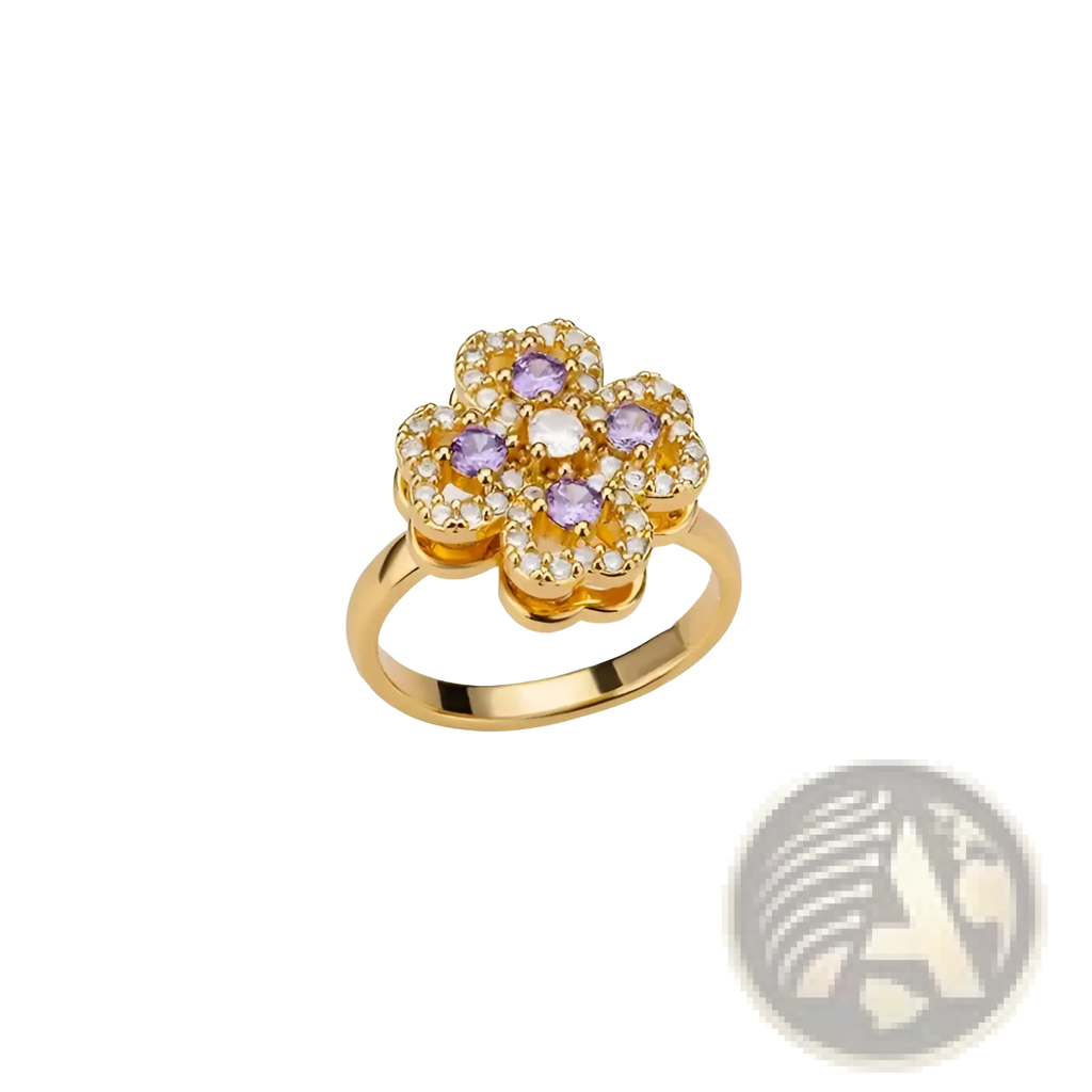 A gold-toned rotating zircon four leaf clover adjustable ring with purple and clear gemstones in a flower shape